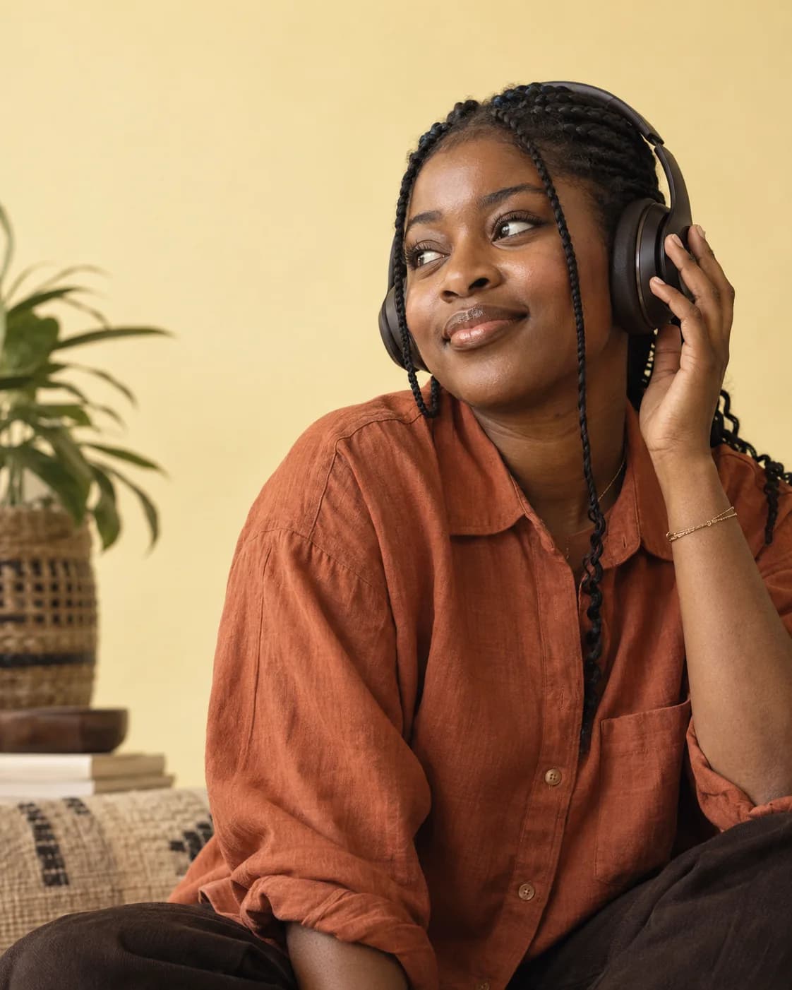 A participant listening carefully while trying headphones